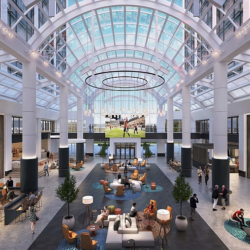 A large building with people and tables.